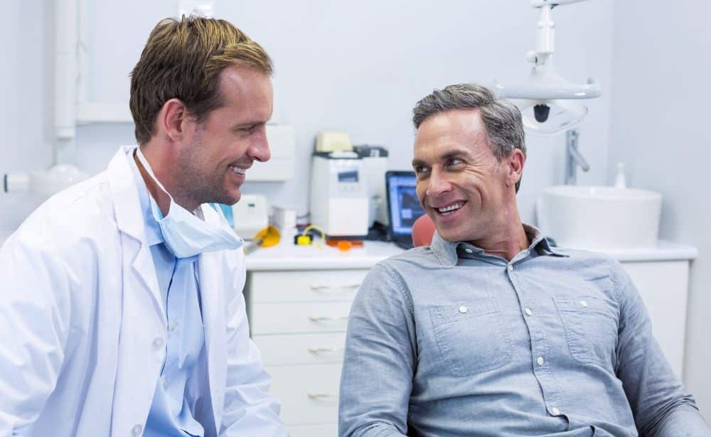 dentist talking to patient