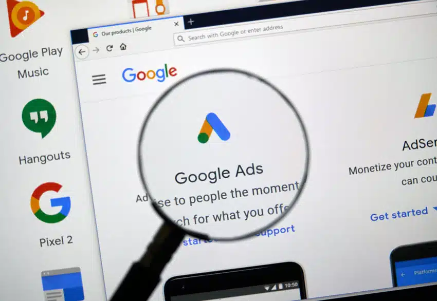 magnify glass over web window of google ads