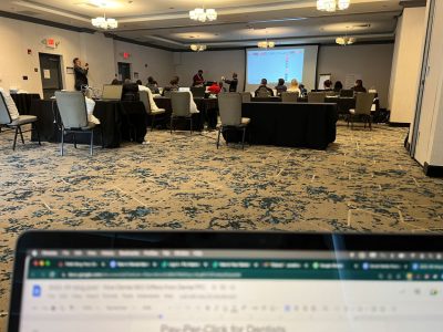 viewing the presentation room from the back wall