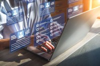 hands working on laptop to improve dental seo