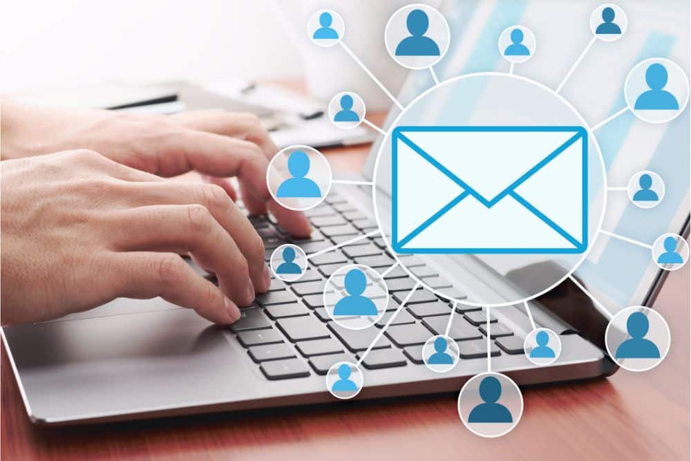 hands typing a new email to regain existing dental patients
