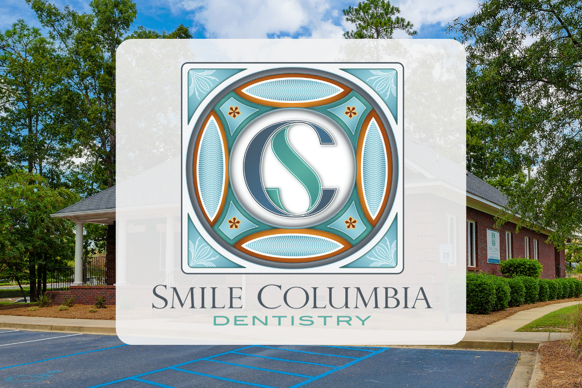 Smile Columbia Dentistry logo in front of exterior of building