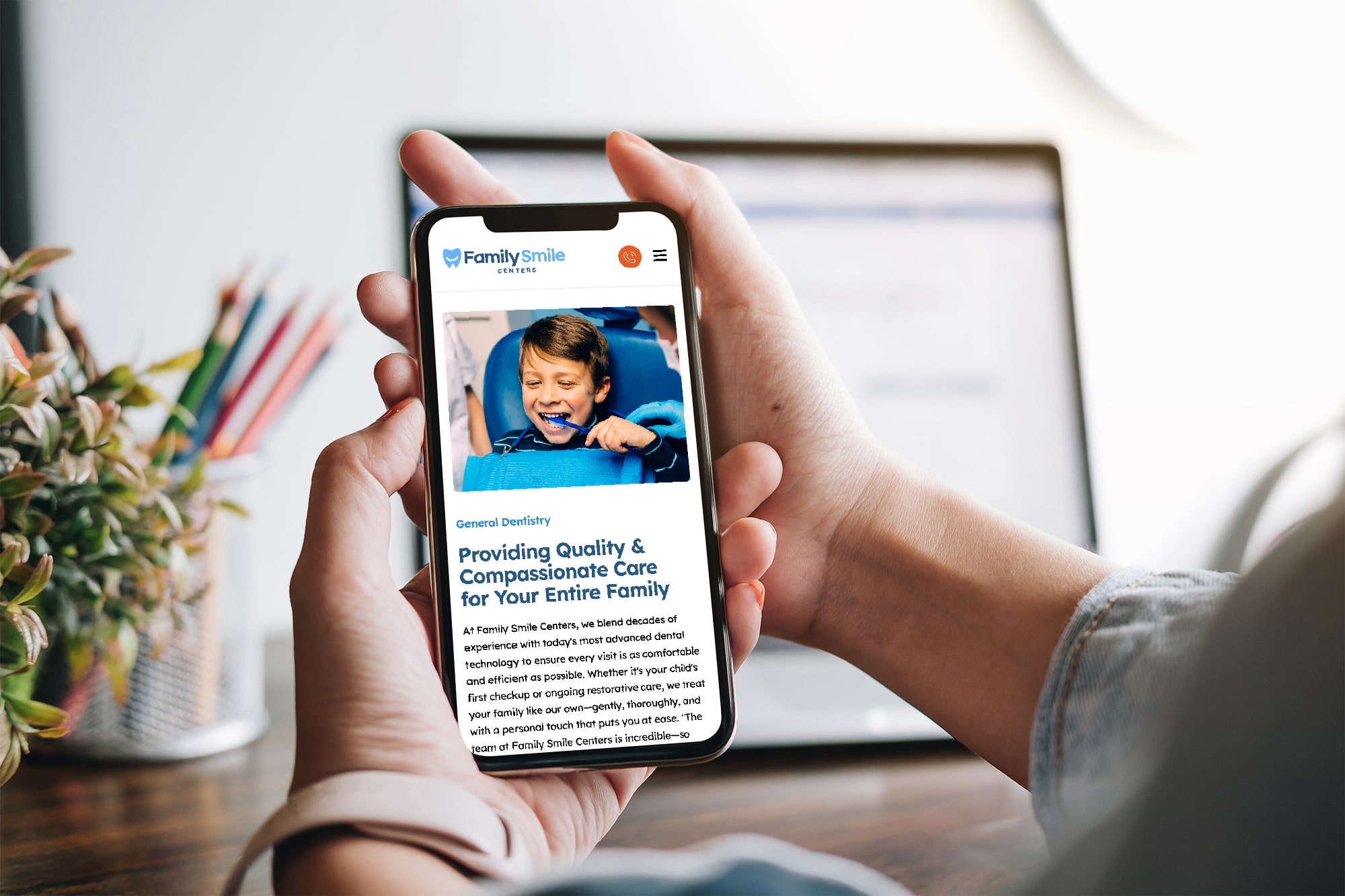 OurProcess-min Person viewing a pediatric dental care page on a mobile device, showing a child patient at the dentist.